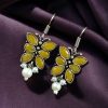 Pair of beautiful brass butterfly hook earrings with sparkling stone accents, ideal for daily wear