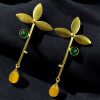 Premium gold-plated brass long stud earrings featuring sparkling Monalisa stones, perfect contemporary design.