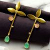 Premium gold-plated brass earrings featuring sparkling Monalisa stones, perfect contemporary design.