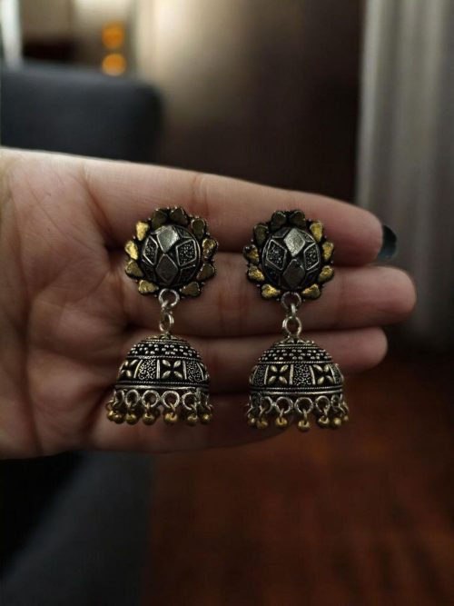 Elegant two-tone German silver stud jhumka earrings with intricate detailing, perfect for ethnic and festive wear.