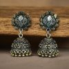 Elegant two-tone German silver stud jhumka earrings with intricate detailing, perfect for ethnic and festive wear.