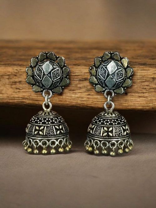 Elegant two-tone German silver stud jhumka earrings with intricate detailing, perfect for ethnic and festive wear.
