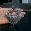 Handcrafted German silver pendant with unique patterns made from raw DIY jewelry materials.