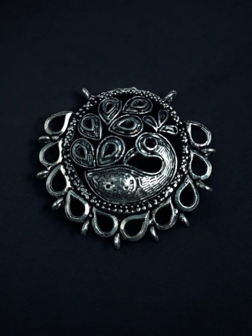 Handcrafted German silver pendant featuring a beautiful peacock-inspired design, made with DIY jewelry materials.