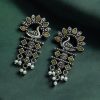 Brass peacock earrings with intricate design, lightweight and elegant