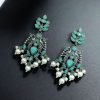 Celebrate tradition with elegance in these Brass Peacock Earrings featuring exquisite stone work and intricate detailing. Designed to complement festive and ethnic outfits, these earrings combine the grace of peacock-inspired motifs with the brilliance of carefully embedded stones.