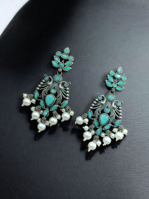Celebrate tradition with elegance in these Brass Peacock Earrings featuring exquisite stone work and intricate detailing. Designed to complement festive and ethnic outfits, these earrings combine the grace of peacock-inspired motifs with the brilliance of carefully embedded stones.