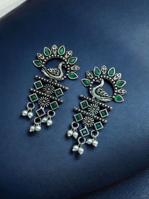 Brass peacock earrings with intricate design, lightweight and elegant
