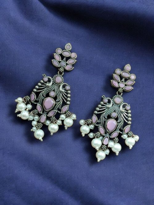 Celebrate tradition with elegance in these Brass Peacock Earrings featuring exquisite stone work and intricate detailing. Designed to complement festive and ethnic outfits, these earrings combine the grace of peacock-inspired motifs with the brilliance of carefully embedded stones.