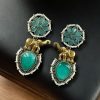 Two-tone elephant dangler earrings with Monalisa stone and pearl work