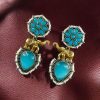 Two-tone elephant dangler earrings with Monalisa stone and pearl work