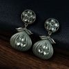 Oxidized silver plated dangler earrings with unique design and stone accents