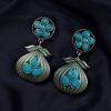 Oxidized silver plated dangler earrings with unique design and stone accents