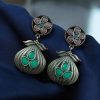 Oxidized silver plated dangler earrings with unique design and stone accents