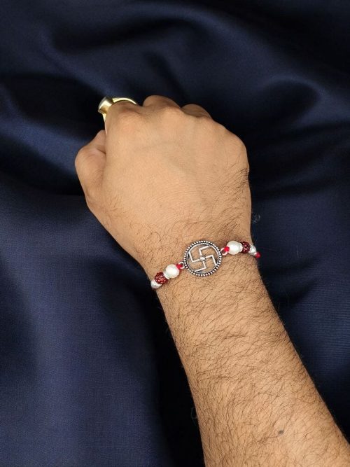 Elegant silver plated Swastik Rakhi with stones for Raksha Bandhan 2025