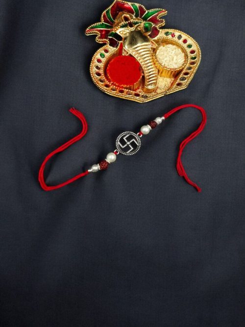 Elegant silver plated Swastik Rakhi with stones for Raksha Bandhan 2025