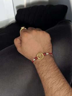 Gold-plated Om Rakhi for brother, Raksha Bandhan