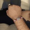 Silver-plated Swastik Rakhi for brother, Raksha Bandhan.