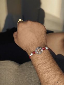 Silver-plated Swastik Rakhi for brother, Raksha Bandhan.