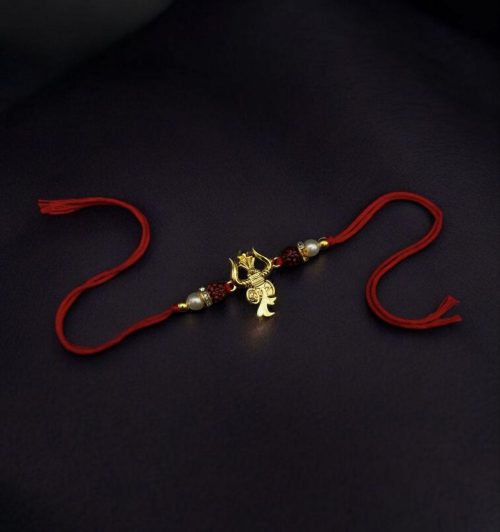 Designer gold-plated Trishul Rakhi for brother, Raksha Bandhan.