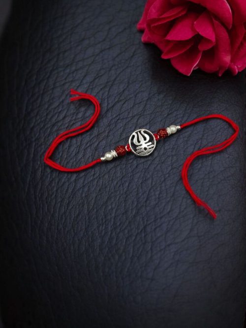 Traditional silver Trishul Rakhi for brother, Raksha Bandhan.