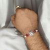 Traditional silver Trishul Rakhi for brother, Raksha Bandhan.