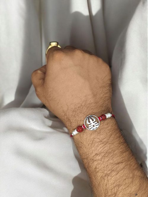 Traditional silver Trishul Rakhi for brother, Raksha Bandhan.