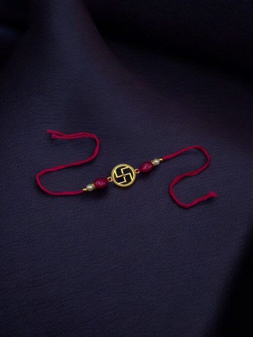 Handcrafted gold-plated Swastik Rakhi for brother, Raksha Bandhan 2025.