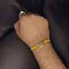 Gold-plated Swastik Rakhi for brother, Raksha Bandhan 2025.