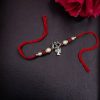 Handcrafted silver Trishul Rakhi for brother.