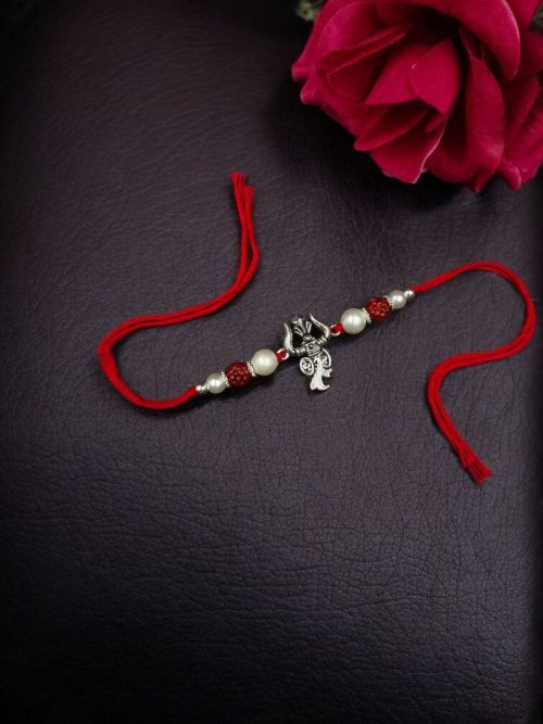 Handcrafted silver Trishul Rakhi for brother.