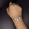 Handcrafted silver Trishul Rakhi for brother.