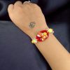 Kids' Tom & Jerry gold-plated resin Rakhi.