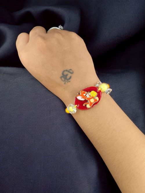 Kids' Tom & Jerry gold-plated resin Rakhi.