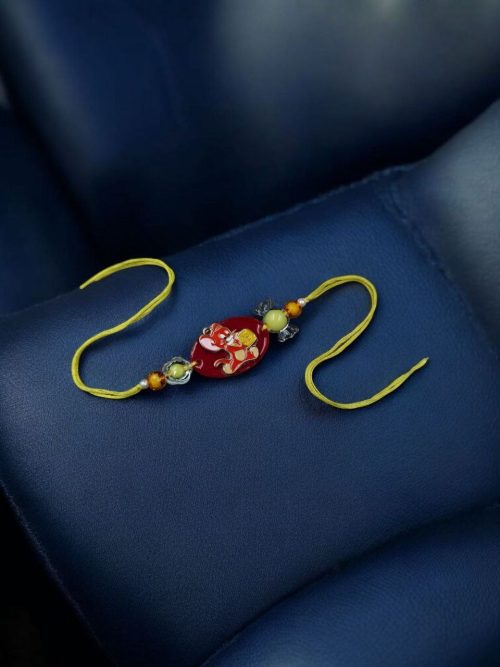 Kids' Tom & Jerry gold-plated resin Rakhi.