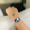 Kids' gold-plated Panda Resin Rakhi.
