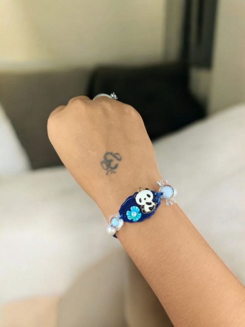 Kids' gold-plated Panda Resin Rakhi.