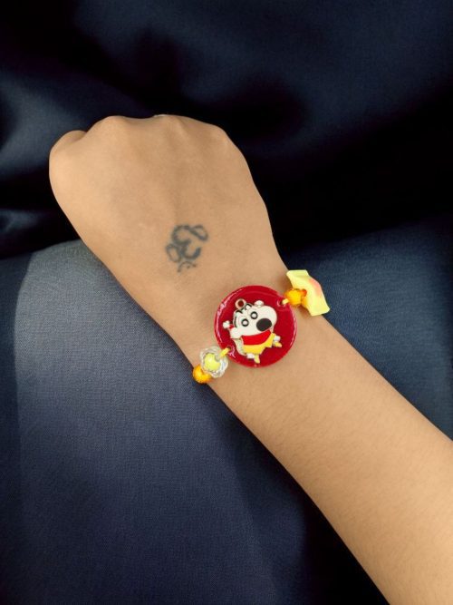 Kids' gold-plated Doll Resin Rakhi.