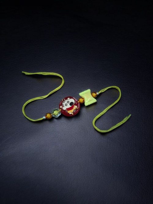 Kids' gold-plated Doll Resin Rakhi.