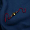 Gold-plated Trishul Rakhi for brother.