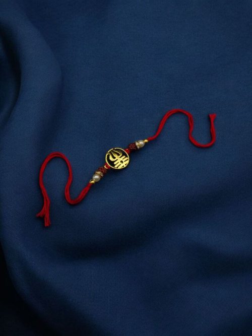 Gold-plated Trishul Rakhi for brother.