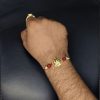 Gold-plated Trishul Rakhi for brother.