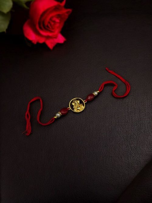 Handcrafted premium gold-plated Ganesha Rakhi for brother.