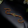 Designer Oxidized Gold Plated Swastik Rakhi