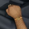 Designer Oxidized Gold Plated Swastik Rakhi