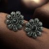 Oxidized silver plated flower stud earrings with stone work