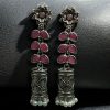Silver plated oxidized jhumki earrings with stone and pearl detailing in traditional ethnic design