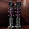 Silver plated oxidized jhumki earrings with stone and pearl detailing in traditional ethnic design