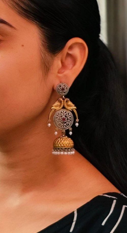 Two-tone parrot earrings with jhumka design, pearl and stone detailing