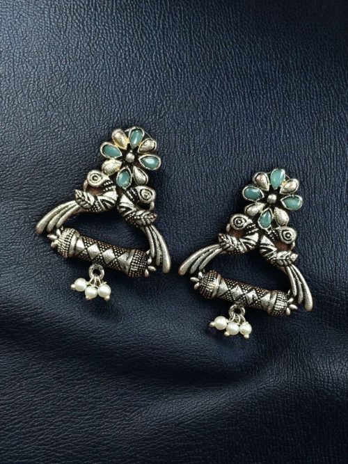 German silver peacock stud earrings with pearl and stone detailing